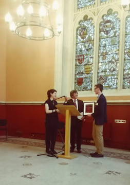 Daniel Armstrong (right) received his prize from Melvyn Bragg (centre) at the reception. Also pictured Sophie Ambler of the Magna Carta Project
